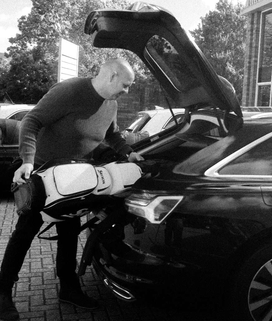 Marketing Consultancy – Ian putting golf clubs in car boot